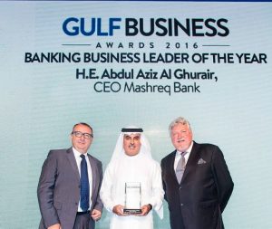 Abdul Aziz Al Ghurair holding the Banking Business Leader of the Year award