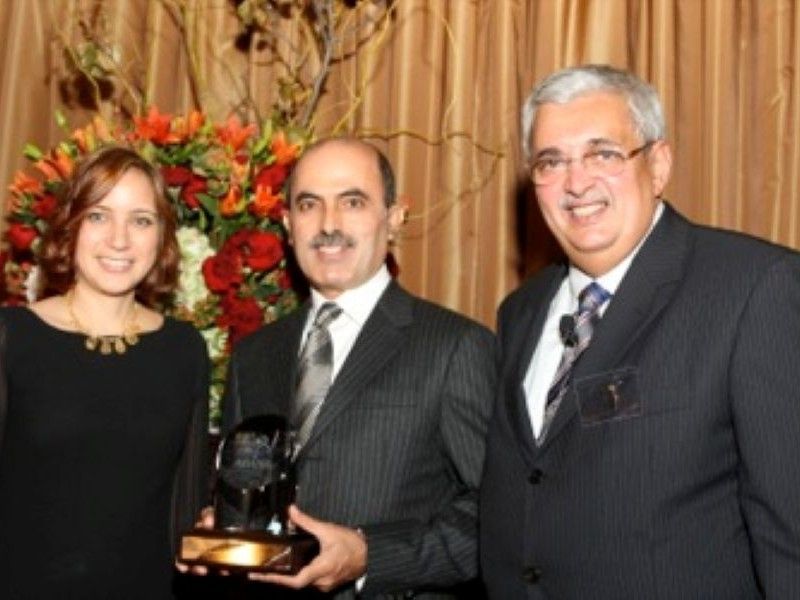 Abdul Aziz Al Ghurair holding the Lifetime Achievement Award