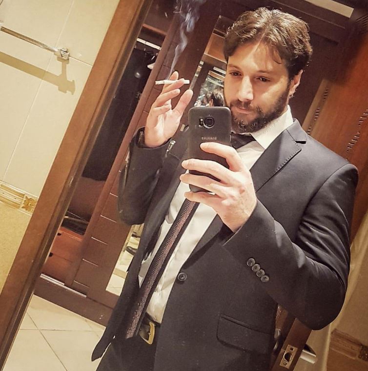 Mohammed Al Ahmad smoking a cigerette