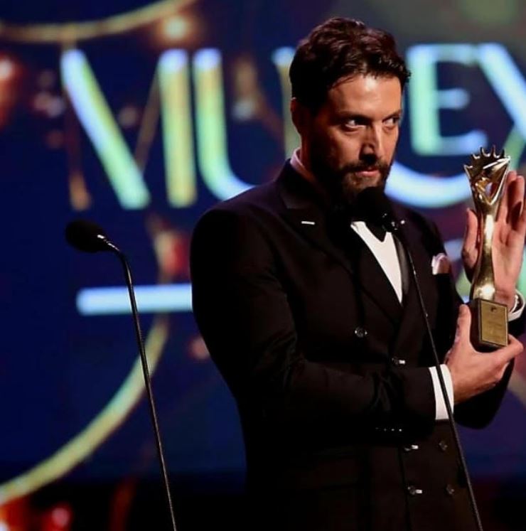 Mohammed Al Ahmad posing with his award