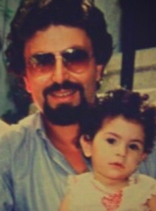 A young Deema Bayyaa with her father
