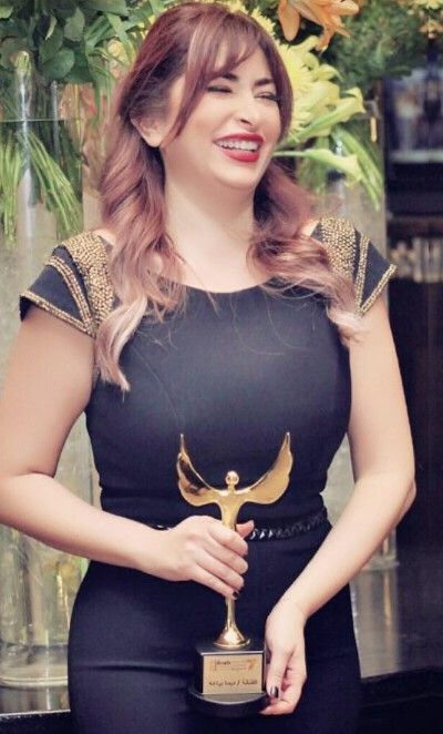 Deema Bayyaa with the Arab Satellite Festival Award