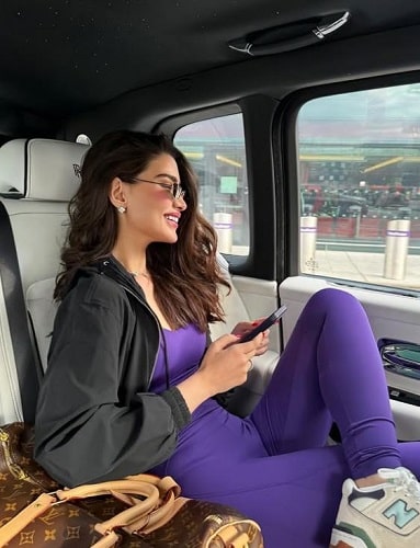 Rawan Bin Hussain sitting in her Rolls Royce