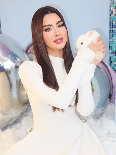 Rawan Bin Hussain with her pet rabbit