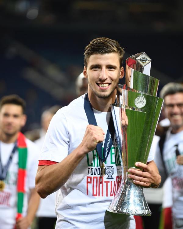 Rúben Dias posing with the UEFA Nations League trophy