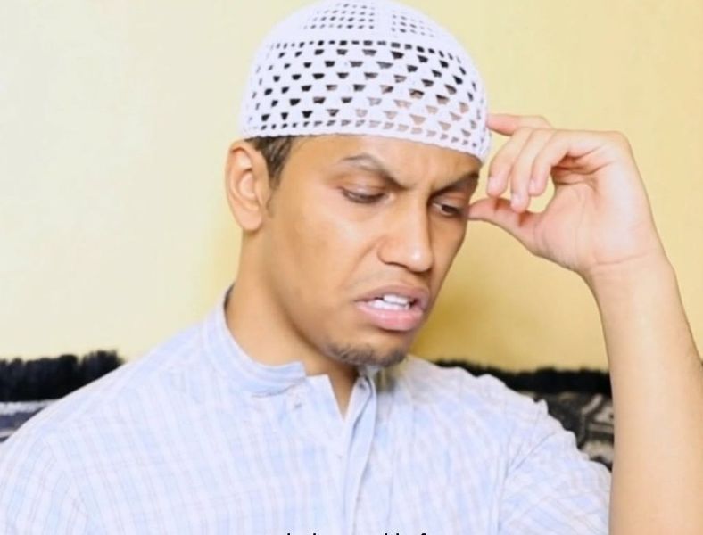 Zubair Sarookh as the character Abu Zubair