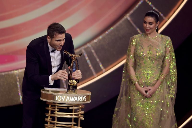 Ahmed Ezz's photo during the award ceremony at Joy Awards