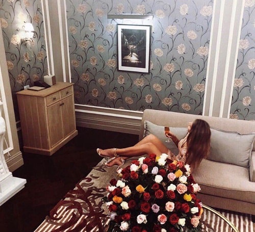 Emilia Dobreva holding a glass of wine