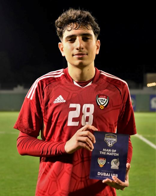 Hazim Abbas holding Man of the Match award