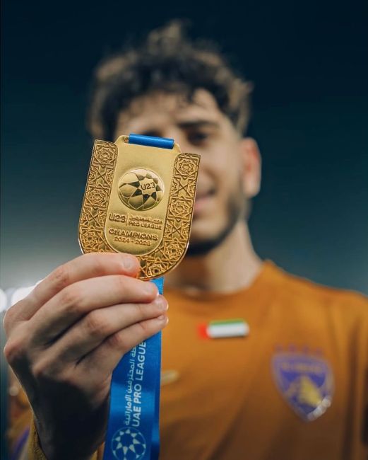 Hazim Abbas holding UAE Pro League U-23 gold medal