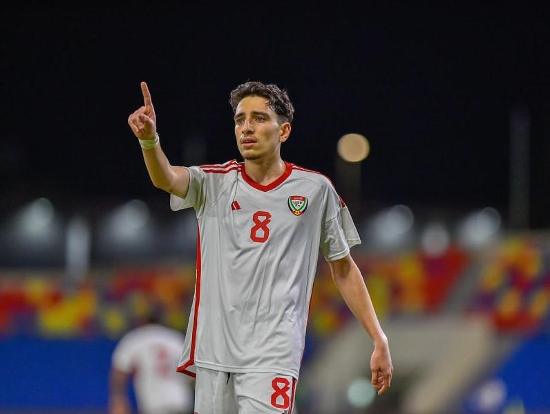 Hazim Abbas wearing jersey number 8, representing the United Arab Emirates national football team