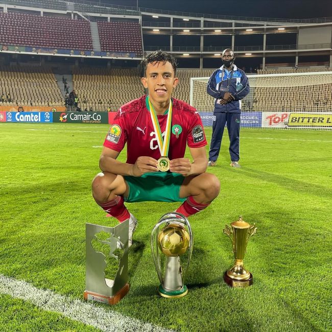Soufiane Rahimi with the Best Player and Top Scorer awards along with the tournament trophy at the African Nations Championship