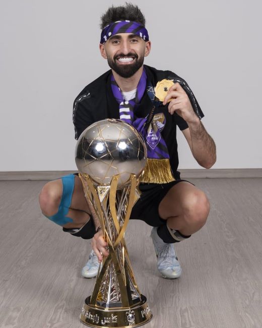 Yahia Nader holding the UAE Pro League Cup (2022)
