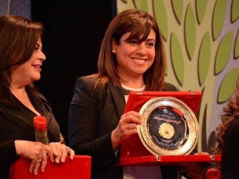 Nashwa Mustafa receiving award from the Catholic Center for Cinema